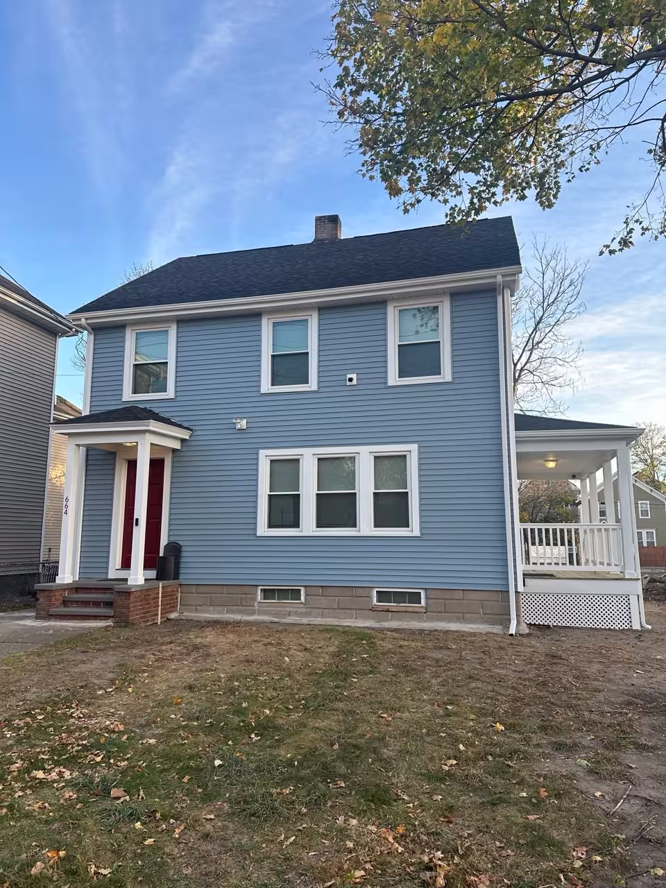 Same house after full vinyl siding and window replacement
